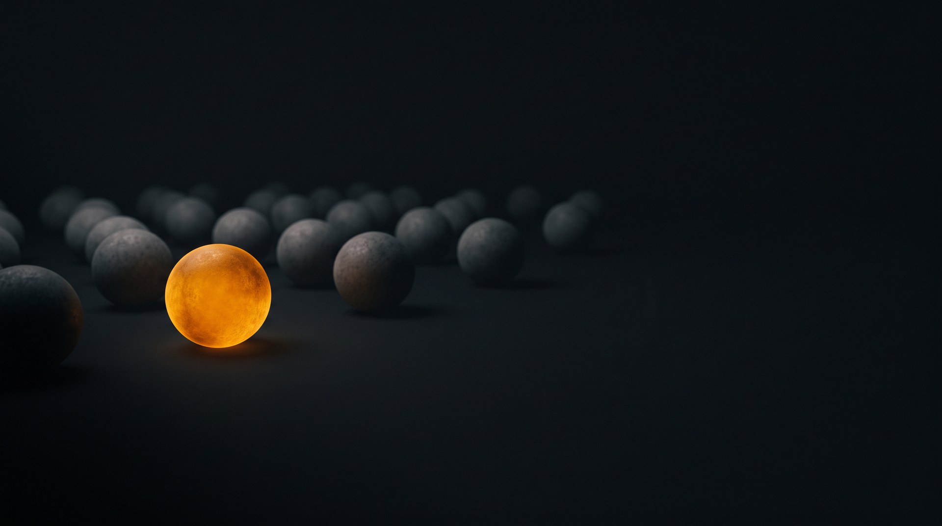 One glowing amber sphere among dozens of dim grey spheres on a dark background — the one account that gets seen